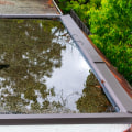 What Type of Drainage System Should Be Used for a Flat or Low-Slope Roof in Conover NC?